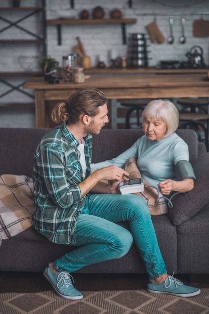 Man taking care of his sick mom