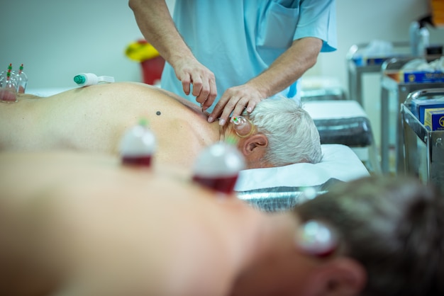 man taking cupping therapy for his body