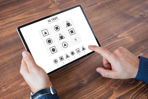 Man taking iq test on tablet