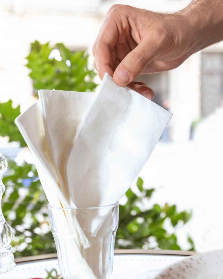 Man taking a napkin at the restaurant
