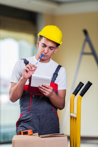 Man taking notes for delivery of boxes