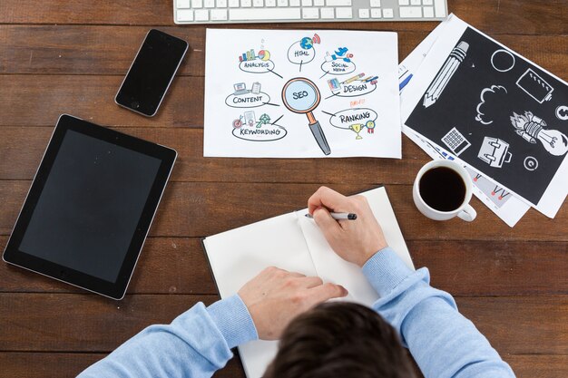 Man taking notes in diary