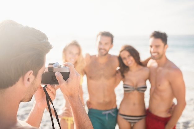 Man taking picture of his friends