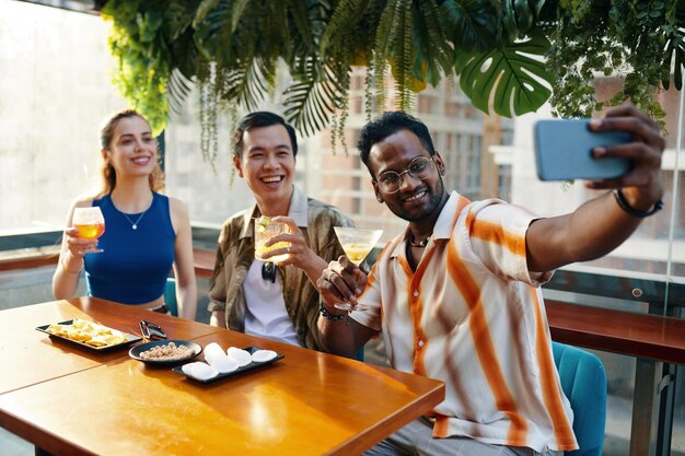 Man taking selfie with friends