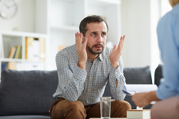 Man talking to counselor