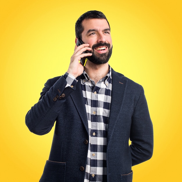 Man talking to mobile on colorful background