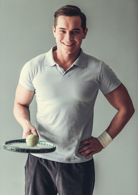 Man tennis player smiling 