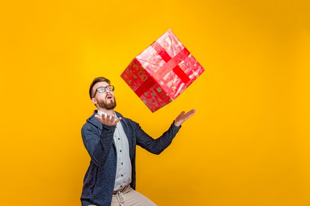 Man throwing present box up