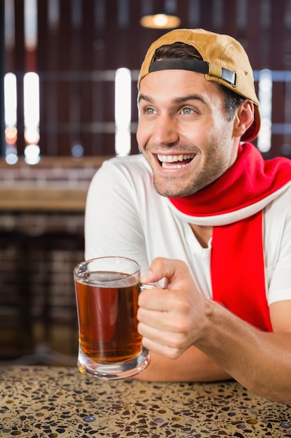 Man toasting a beer