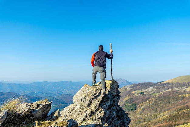 A man on the top of Mount Ernio or Hernio in Gipuzkoa at sunset Basque Country