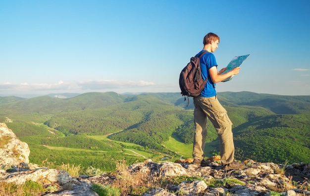 Man on top of mountain. Tourism concept