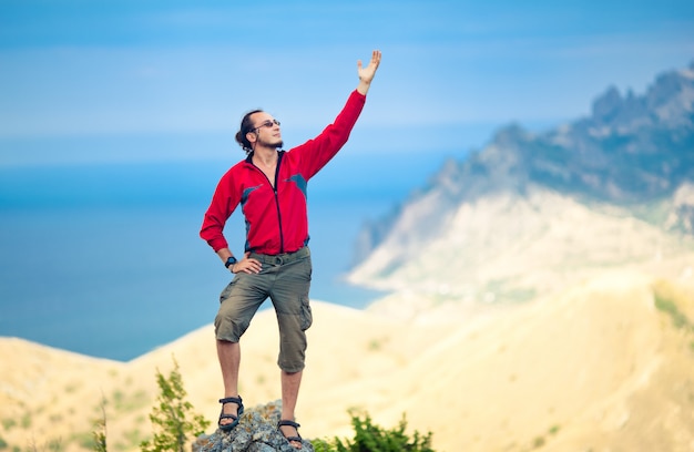 Man on top of mountain