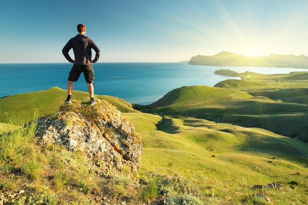 Man on top of mountain