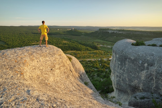 Man on top of mountain