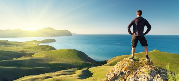 Man on top of mountain