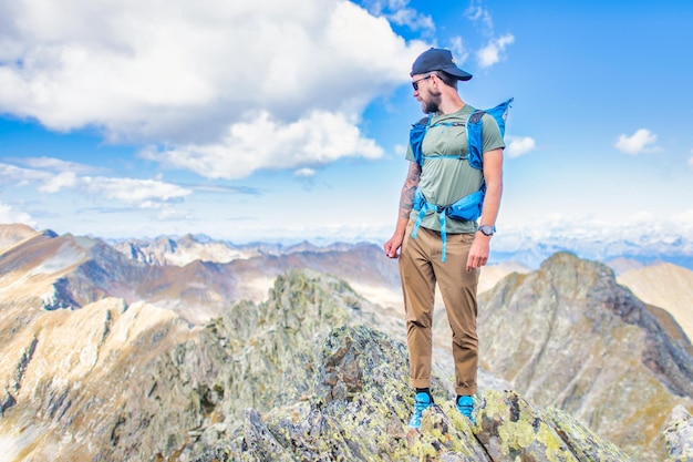 Man at the top of the mountains