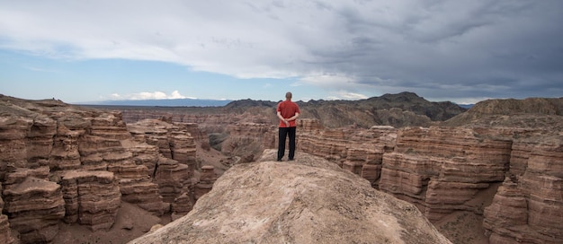 man on top of volcano in summer