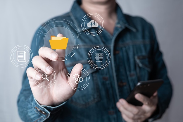 man touch screen to manage datadocument management system dmsknowledge and documentation in enterprise with erponline documentation database and process automation to efficiently manage files