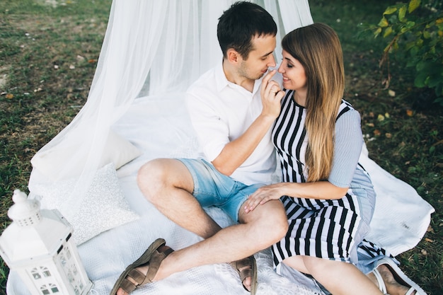 Man touching nose of his wife