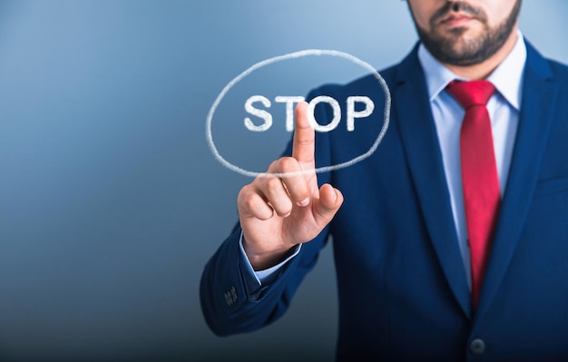 Man touching stop in screen