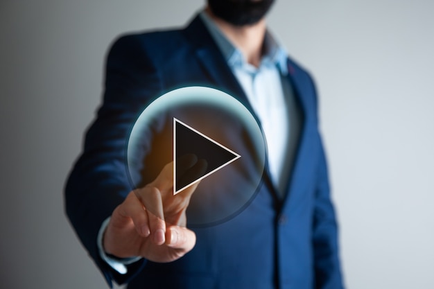 Man touching video sign in screen