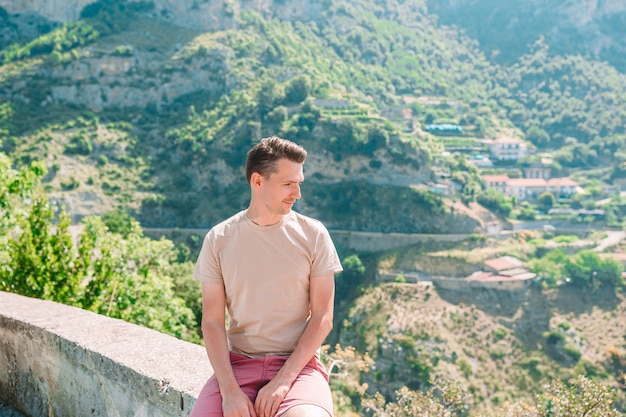 Man tourist outdoors in italian village on vacation