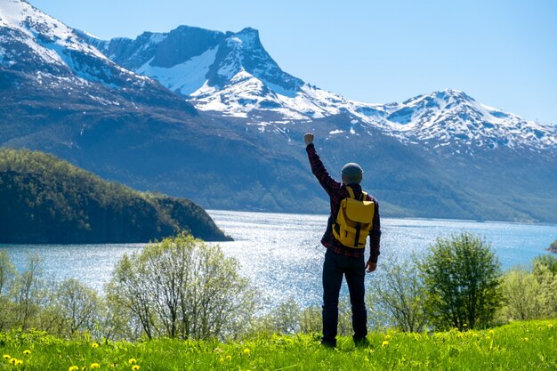 Man tourist with standing of great mountain Scandinavia nature