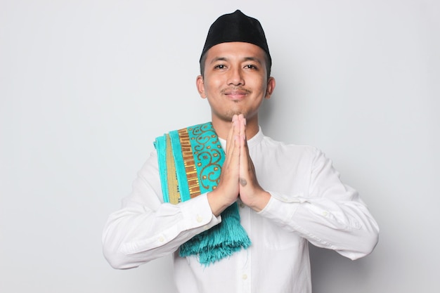 A man in a traditional dress with a traditional outfit and the word bali on the front