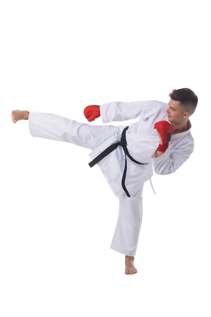 Man training taekwondo on white