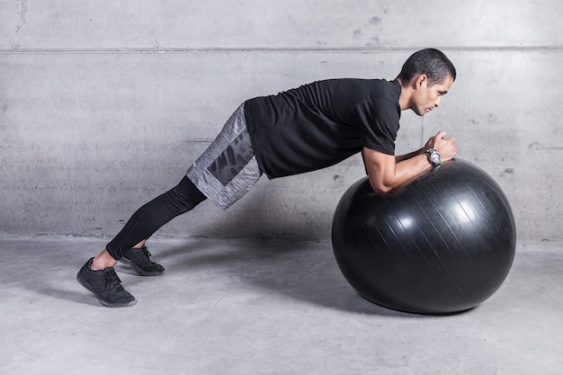 Man training with medicine ball