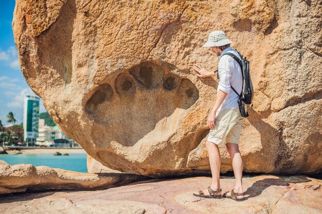 Man traveler at the Hon Chong cape, Garden stone, popular tourist destinations at Nha Trang. Vietnam