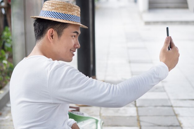 Man traveler taking selfie, photo, upload to social media