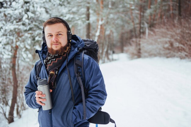 Man Traveler with backpack hiking Travel Lifestyle adventure  active vacations outdoor. Beautiful landscape  forest