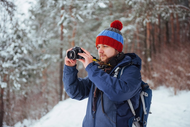 Man Traveler with backpack hiking Travel Lifestyle adventure  active vacations outdoor. Beautiful landscape  forest