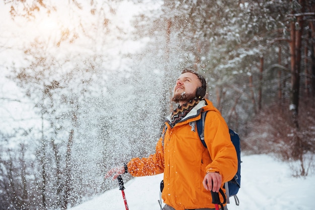 Man Traveler with backpack hiking Travel Lifestyle adventure  active vacations outdoor. Beautiful landscape  forest