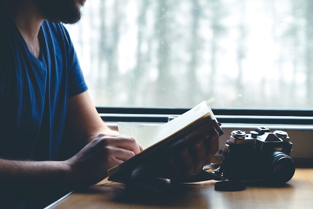 Man travels by train sitting by the window