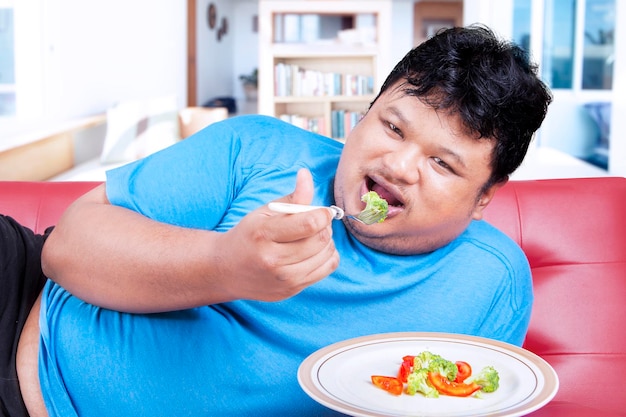 Man try to diet by eating vegetable 3