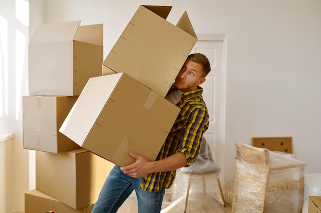 Man trying to keep balance holding box