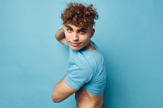 Man in a Tshirt posing against the background