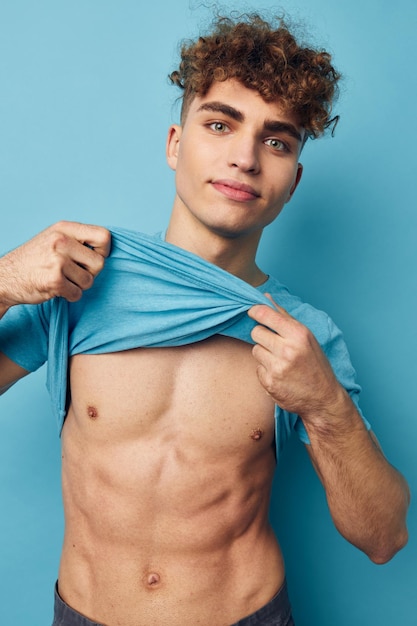 Man in a Tshirt posing against the background