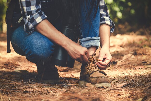 Man tying shoelace for trekking 