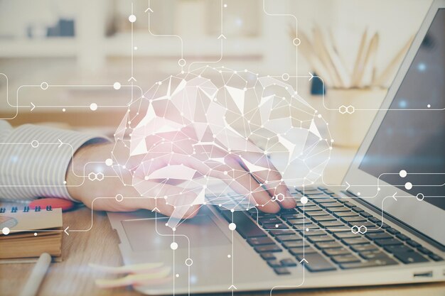Man typing on keyboard background with brain hologram Concept of big Data Double exposure