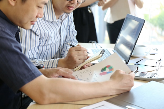 Man Typing Keyboard Laptop Hand. Business Team Working Startup modern Office.