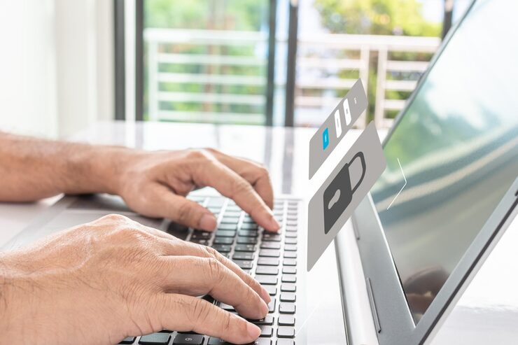 Photo man typing on keyboard to use computer network laptop screen showing login for security system concept work at home with computers and internet notebook computer on table close up blur backgroundxa
