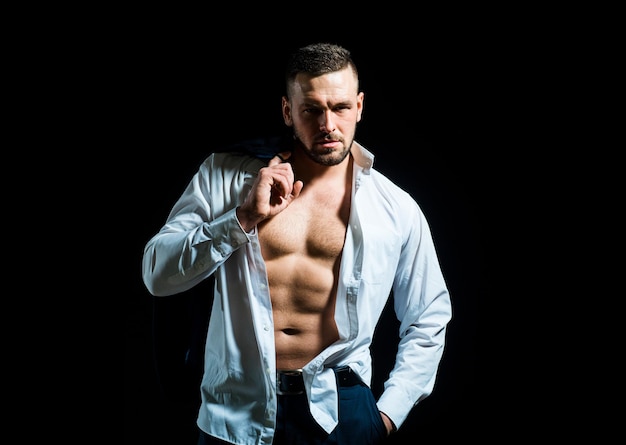 Man undressed shirt Sexy man with muscular body and bare torso