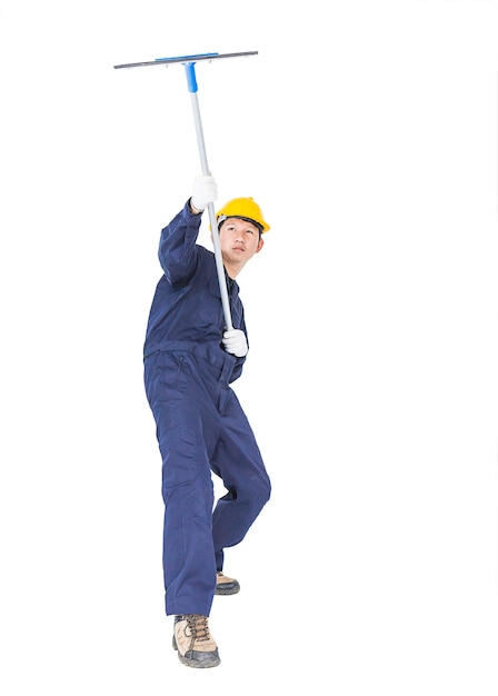 Man in uniform hold mop for cleaning glass window with clipping path