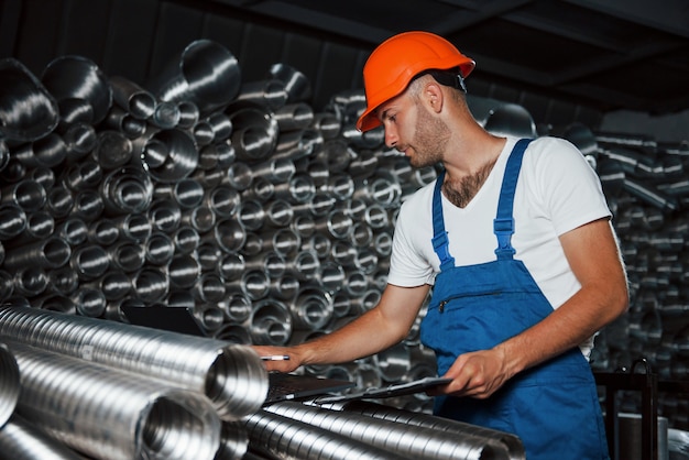 Man in uniform works on the production