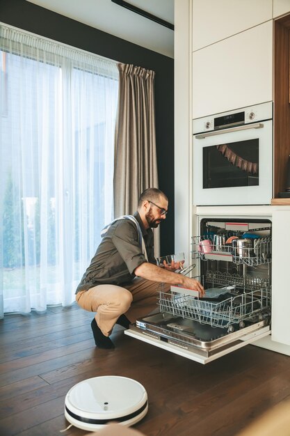 The man unloading dishwasher