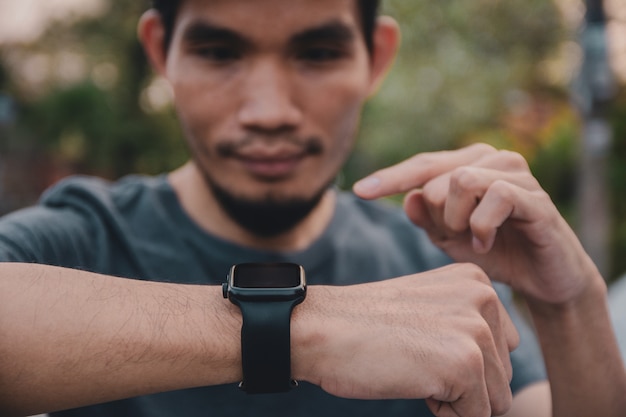 Man use smartwatch for running