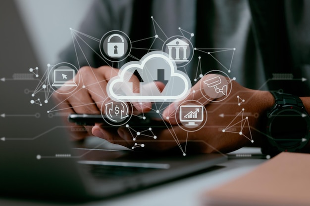 A man uses a laptop with a cloud computing diagram on it\
concepts of data storage networking and internet service for cloud\
computing